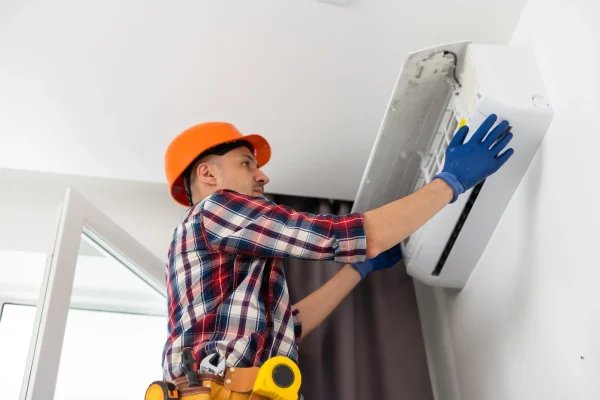 repairman-working-on-air-conditioning-inside-2026-03-16-23-52-23-utc